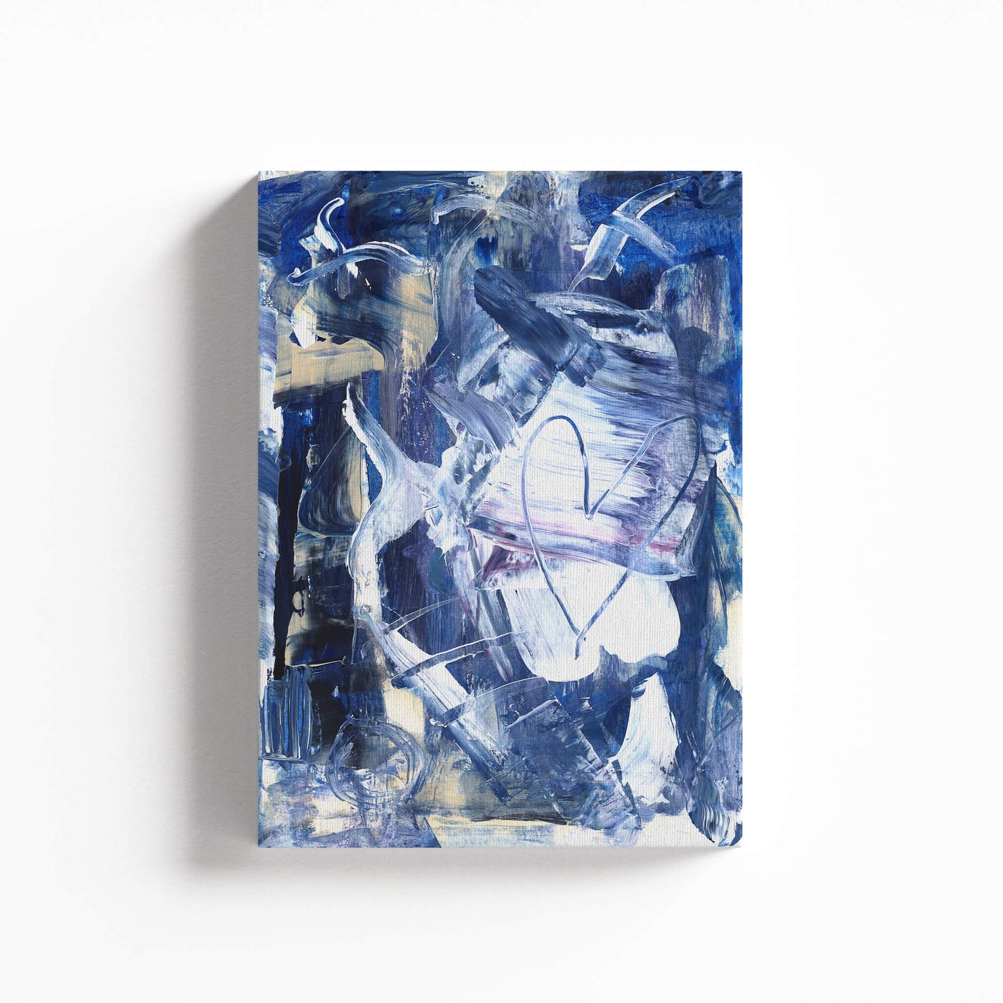 A blue abstract canvas painting with broad brushstrokes and a light-colored heart shape in the center right